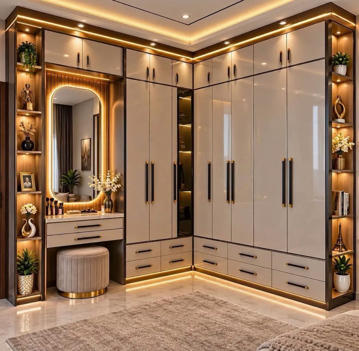 21 Closet Design Plans for Every Layout and Budget 12 Modern beige walk-in closet with integrated LED lighting, a vanity mirror, and built-in shelving units.
