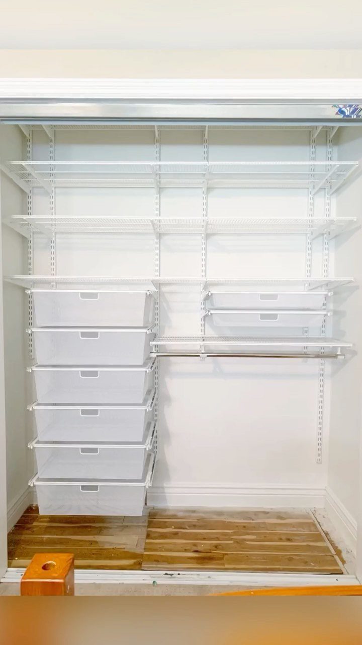 DIY Closet Organization: 16 Ideas for Every Layout 2 White adjustable closet shelves with a stack of six white storage bins on the left side.