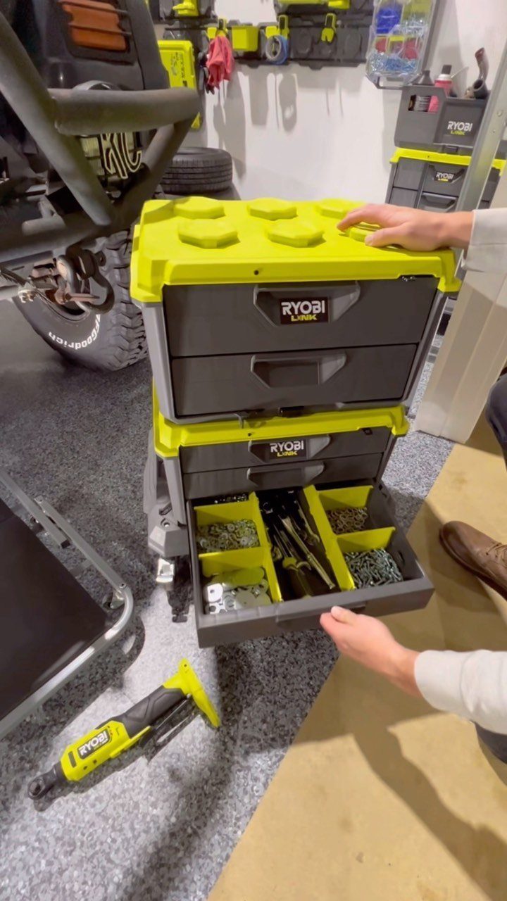 Garage Storage Modern: 12 Ideas That Free Up Floor Space 3 Hands opening a drawer of stacked Ryobi modular storage containers in a garage setting.