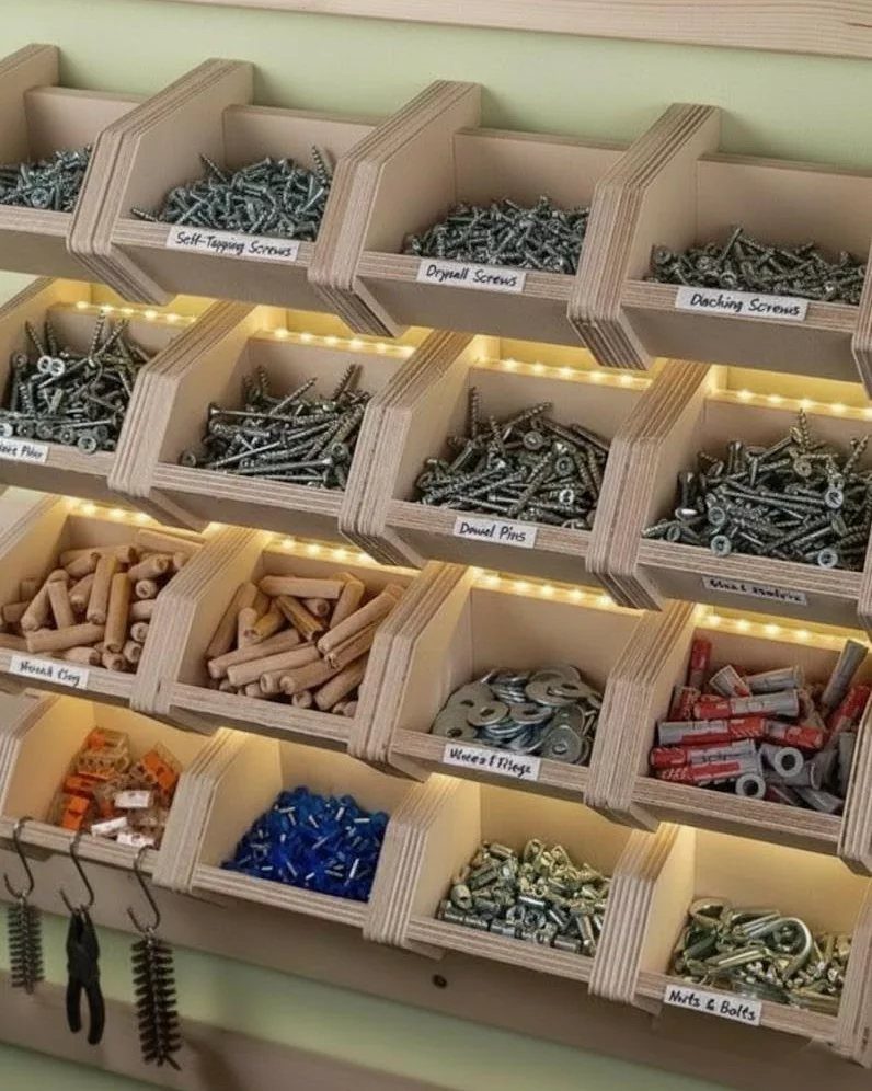 11 Tool Shed Storage Ideas for Every Wall and Corner 10 Wooden wall-mounted bins filled with various hardware items like screws, dowels, and bolts.